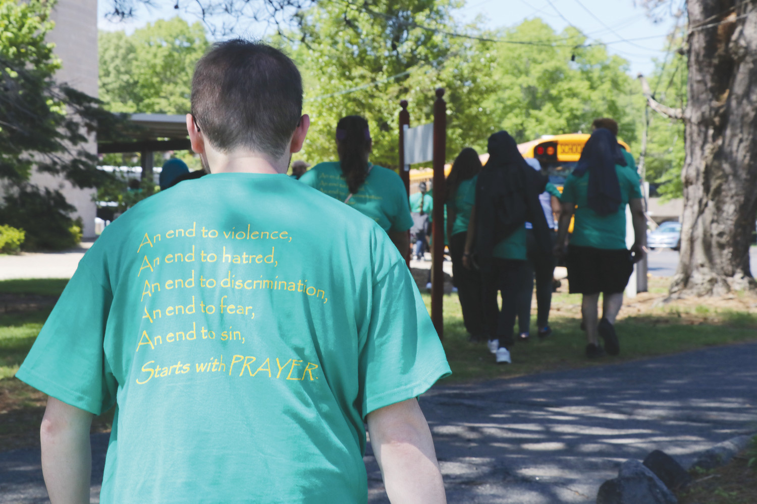Students and staff wore shirts with a hopeful message that making peaceful and effective changes in society should always start with prayer.